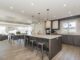 Diseño de interiores - Vista de una cocina remodelada con la mejor iluminación y materiales de lujo realizado por las mejores empresas de diseño de interiores en CDMX